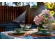 Outdoor dining arrangement with hammock in the background at 12292 W 65Th Ave, Arvada, CO 80004