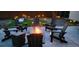 Outdoor fire pit with cozy seating for evening relaxation and gathering at 12292 W 65Th Ave, Arvada, CO 80004