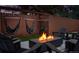 Cozy outdoor space featuring a modern fire pit, hammocks, and comfortable seating at 12292 W 65Th Ave, Arvada, CO 80004