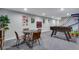 Finished basement with a foosball table, seating area, and a basketball game at 12292 W 65Th Ave, Arvada, CO 80004