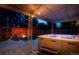 Inviting backyard with a hot tub, fire pit, and comfortable seating area at 12292 W 65Th Ave, Arvada, CO 80004