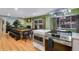 This spacious kitchen features stainless steel appliances, a unique mural, and a dining area perfect for Gathering gatherings at 12292 W 65Th Ave, Arvada, CO 80004