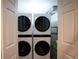 Convenient laundry area with stacked washer and dryer, maximizing space at 12292 W 65Th Ave, Arvada, CO 80004