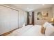 Comfortable main bedroom with a king bed, closet space and natural light at 12292 W 65Th Ave, Arvada, CO 80004