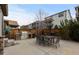 Concrete backyard patio featuring a built-in BBQ grill, outdoor dining, and wood fence at 549 Tippen Pl, Castle Rock, CO 80104