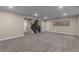 Finished basement area featuring neutral paint, carpet, stairs, and ample space at 549 Tippen Pl, Castle Rock, CO 80104