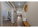Inviting hallway with hardwood floors, neutral walls, and access to various rooms in the home at 549 Tippen Pl, Castle Rock, CO 80104