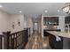 Hallway view of a kitchen with stainless steel appliances and a backsplash that adds a touch of elegance at 549 Tippen Pl, Castle Rock, CO 80104