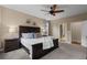 Relaxing main bedroom features a king-size bed, bedside tables, and an ensuite bathroom at 549 Tippen Pl, Castle Rock, CO 80104