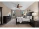 Comfortable main bedroom with a plush bed, dresser, bedside tables, and neutral décor at 549 Tippen Pl, Castle Rock, CO 80104