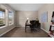 Well-lit office space with a large window and neutral walls, perfect for a work-from-home setup at 549 Tippen Pl, Castle Rock, CO 80104