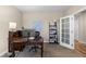 Comfortable office with a work station, bookshelf, and adjacent door for a quiet professional workspace at 549 Tippen Pl, Castle Rock, CO 80104
