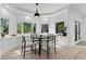 Bright breakfast nook with a round table and chairs near windows at 1919 Bellaire St, Denver, CO 80220