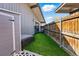 Low maintenance backyard featuring privacy fence, artificial turf and storage shed at 6495 E Happy Canyon Rd # 62, Denver, CO 80237