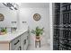 Updated bathroom featuring modern vanity, sleek fixtures, and stylish black and white patterned shower curtain at 6495 E Happy Canyon Rd # 62, Denver, CO 80237