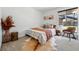 Cozy bedroom with a decorative rug, comfortable seating, and a bright window view at 6495 E Happy Canyon Rd # 62, Denver, CO 80237