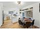 Modern dining area featuring a unique table, stainless steel appliances, and updated cabinets at 6495 E Happy Canyon Rd # 62, Denver, CO 80237