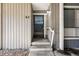 Close-up of a condo front door with a secure screen door and a welcoming entrance at 6495 E Happy Canyon Rd # 62, Denver, CO 80237