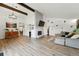Bright living room featuring vaulted ceilings, a brick fireplace, and an open floor plan at 6495 E Happy Canyon Rd # 62, Denver, CO 80237