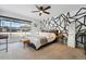Bright main bedroom featuring modern accent wall, ceiling fan and large window with neighborhood view at 6495 E Happy Canyon Rd # 62, Denver, CO 80237
