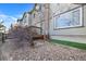 Rock garden and back deck area of the property, offering a view from the side of the home at 13028 Grant W Cir # A, Thornton, CO 80241