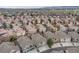 Wide aerial view of a residential community featuring well-spaced townhouses at 1311 Carlyle Park Cir, Highlands Ranch, CO 80129
