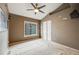 Spacious bedroom featuring a ceiling fan, large window, and a double door closet at 1311 Carlyle Park Cir, Highlands Ranch, CO 80129