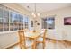 Bright dining room features large windows and ample natural light at 1311 Carlyle Park Cir, Highlands Ranch, CO 80129