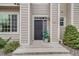 Attractive front door with decorative plants, great curb appeal at 1311 Carlyle Park Cir, Highlands Ranch, CO 80129