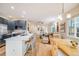 Open floor plan featuring an updated kitchen with counter seating and a spacious living and dining area at 1311 Carlyle Park Cir, Highlands Ranch, CO 80129