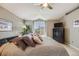 Well-lit main bedroom with large window, neutral walls, and a ceiling fan for added comfort at 1311 Carlyle Park Cir, Highlands Ranch, CO 80129