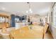 The open concept features the kitchen and dining adjacent to the living room at 1311 Carlyle Park Cir, Highlands Ranch, CO 80129