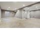 Spacious finished basement with neutral walls and a laundry area at 5154 E 126Th Ct, Thornton, CO 80241