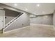 Unfinished basement area with a staircase and concrete floors at 5154 E 126Th Ct, Thornton, CO 80241