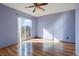 Bright bedroom featuring hardwood floors and sliding glass door to deck at 5154 E 126Th Ct, Thornton, CO 80241