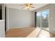 Dining area with hardwood floors, ceiling fan, and sliding glass door to backyard at 5154 E 126Th Ct, Thornton, CO 80241