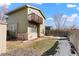 Back exterior view of house with deck and fenced yard at 5154 E 126Th Ct, Thornton, CO 80241