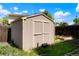 Backyard with a storage shed featuring double doors for ample storage at 5154 E 126Th Ct, Thornton, CO 80241