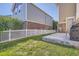 Spacious backyard with a well-manicured lawn and white picket fence that provides privacy and a welcoming outdoor space at 9523 Gray Ct, Westminster, CO 80031