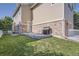 Enjoy outdoor living with this cozy backyard featuring a concrete patio, grill, and well-maintained lawn at 9523 Gray Ct, Westminster, CO 80031
