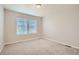 Neutral bedroom offering natural light through two windows and soft carpeting at 9523 Gray Ct, Westminster, CO 80031