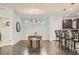 Bright dining room with a modern chandelier, hardwood floors, and open layout at 9523 Gray Ct, Westminster, CO 80031