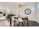 Stylish dining area with hardwood floors, modern chandelier, and view to the living room at 9523 Gray Ct, Westminster, CO 80031