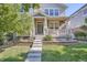 Charming front porch with brick accents, inviting entrance, and well-maintained landscaping at 9523 Gray Ct, Westminster, CO 80031