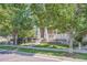 Traditional home with well-manicured front yard and welcoming walkway, framed by mature trees at 9523 Gray Ct, Westminster, CO 80031