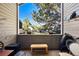 Balcony with string lights and a wooden table at 9797 E Peakview Ave # C10, Englewood, CO 80111