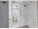 Hallway bathroom and closet featuring a toilet, shower, and shelving at 9797 E Peakview Ave # C10, Englewood, CO 80111