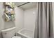 Bathroom featuring a shower with white tiling and gray shower curtain at 9797 E Peakview Ave # C10, Englewood, CO 80111