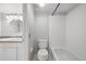 Clean, well-lit bathroom with white tile and a shower-tub combination at 9797 E Peakview Ave # C10, Englewood, CO 80111