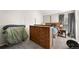 Bedroom featuring grey carpet, brown wooden furniture, and natural light at 9797 E Peakview Ave # C10, Englewood, CO 80111